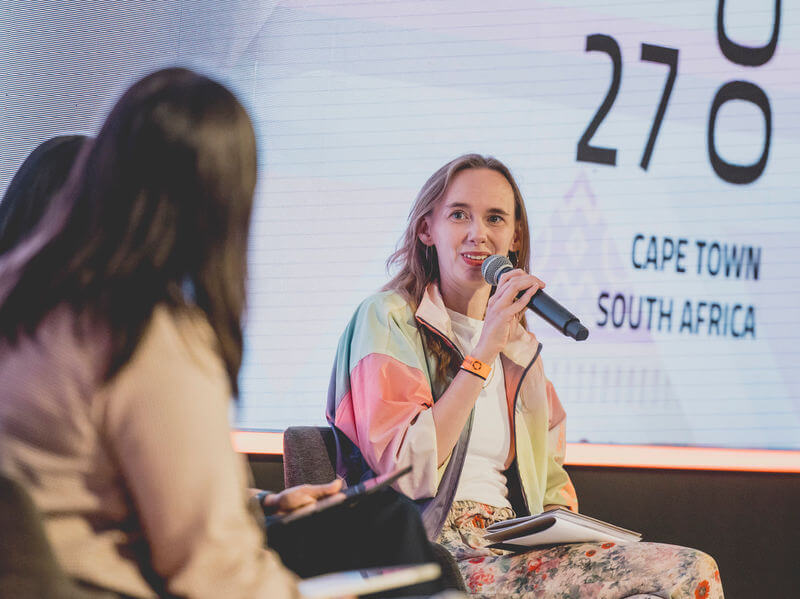 Lady with microphone on stage at Interledger Summit